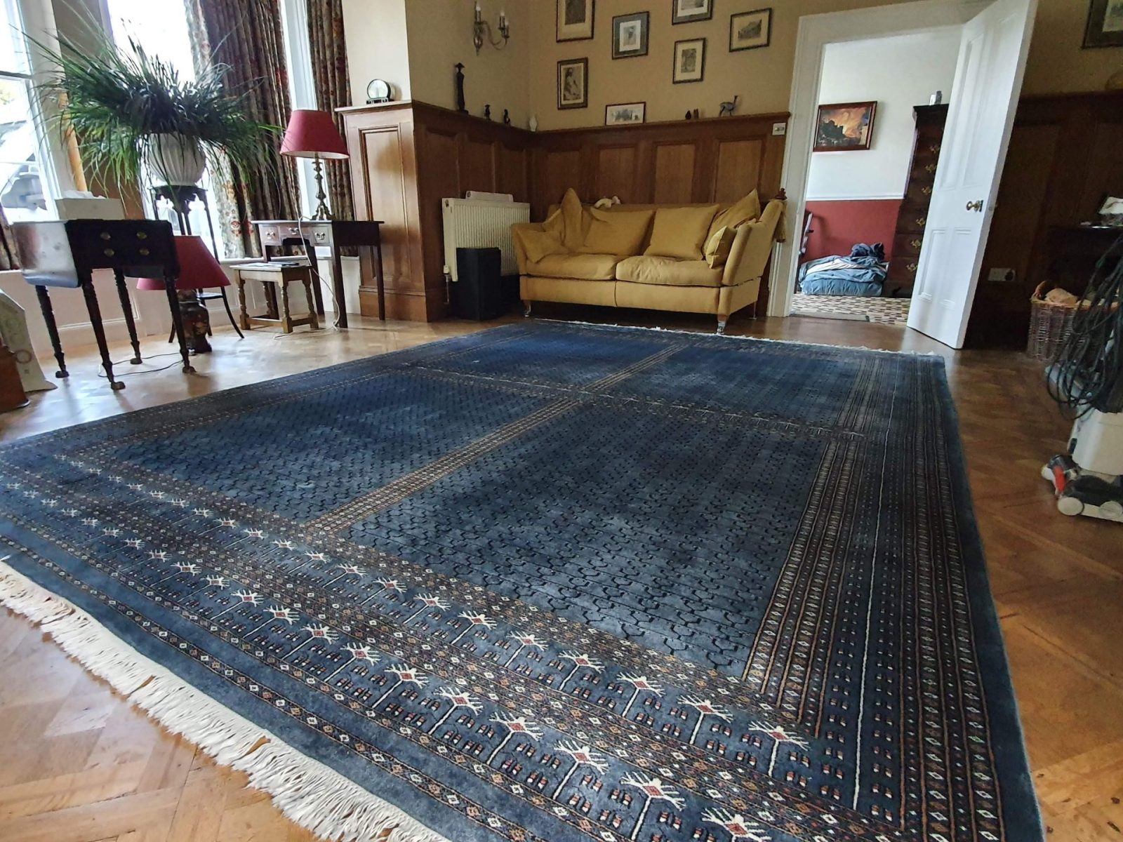 A cleaned and dried wool rug returned to client